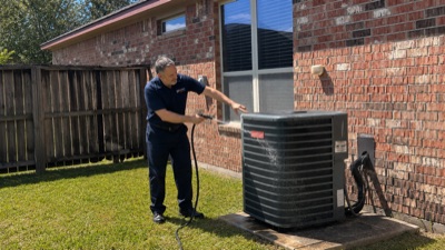 Houston Heating & Air office entrance with technician